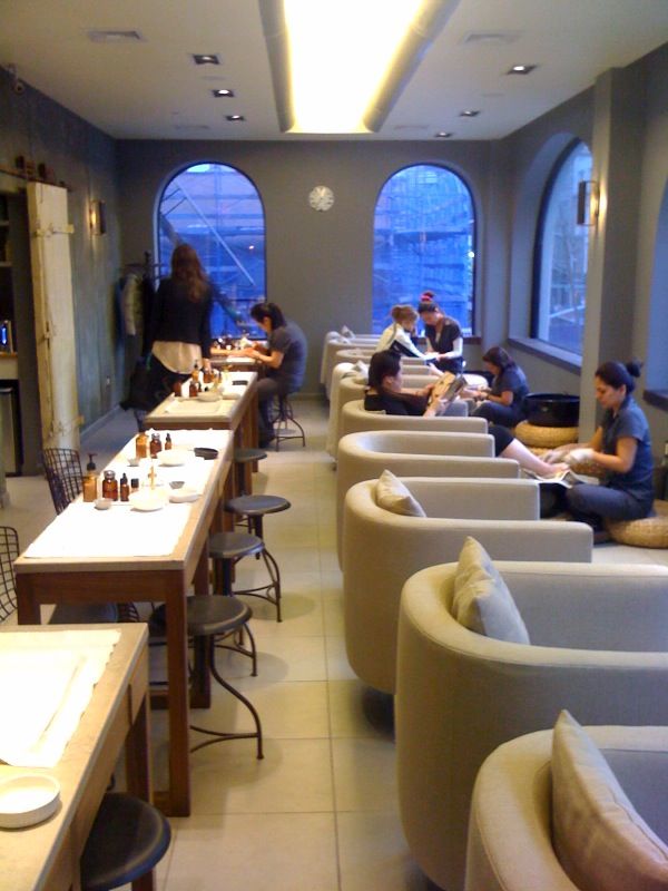 Modern spa salon with nail and foot care stations